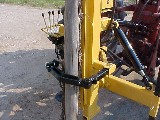 Another view of the fence post stabilizer option on the Model 40 post driver.